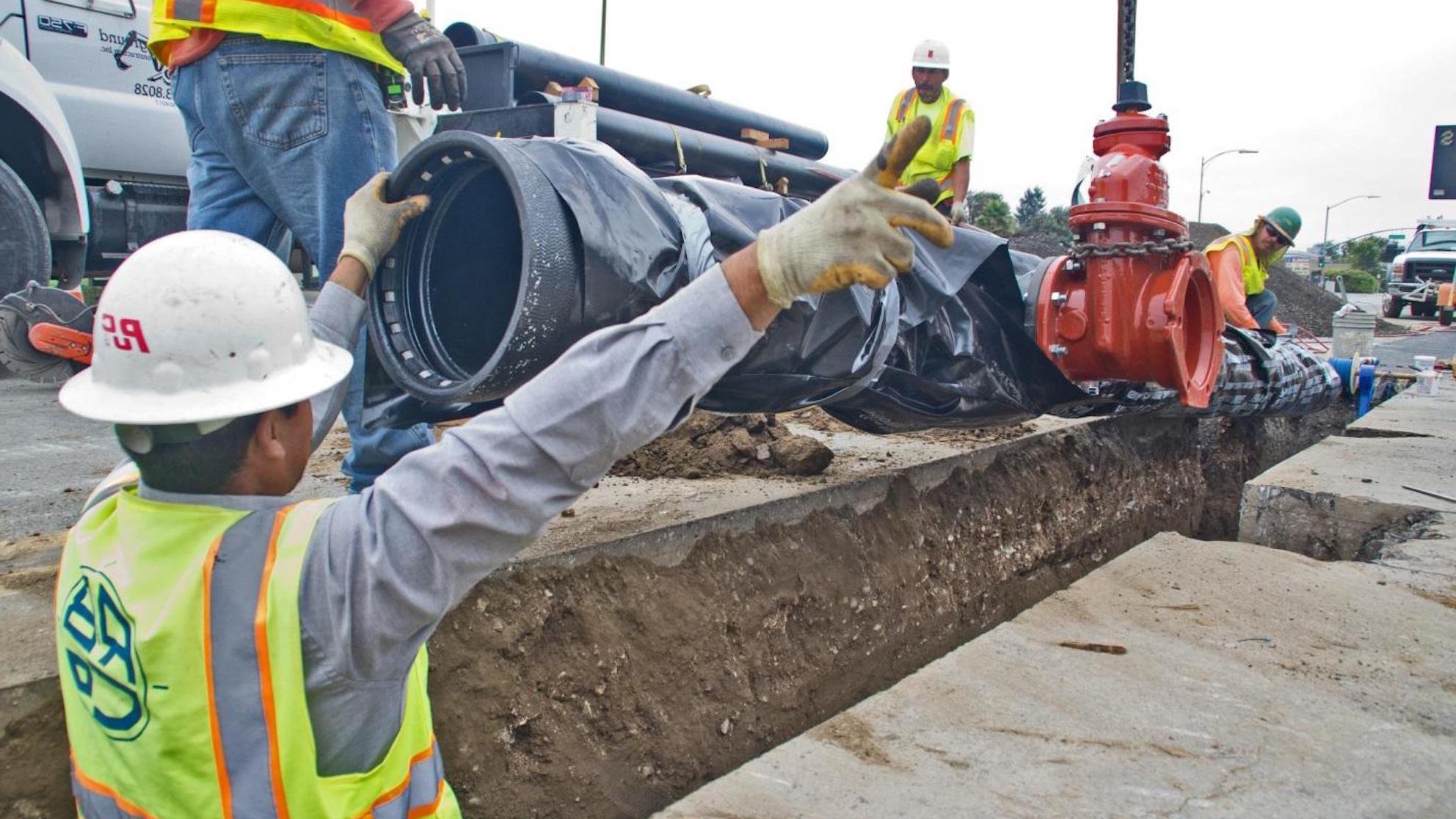 SJW employees updating water pipe