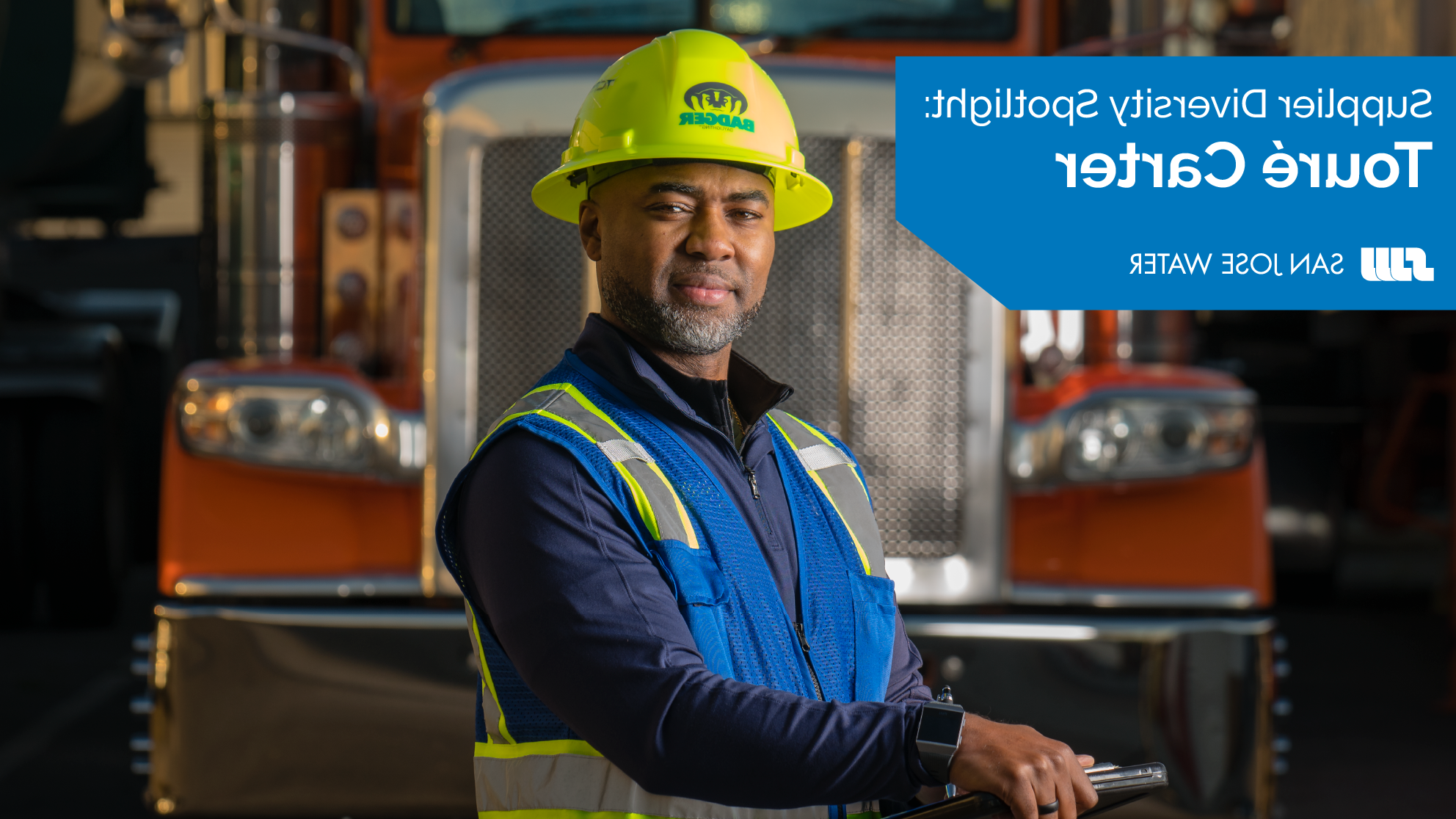 Touré Carter in front of one of his company trucks